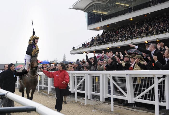 A jubilant Denis O’Regan hails the crowd after Inglis Drever’s third Stayers’ Hurdle win.
