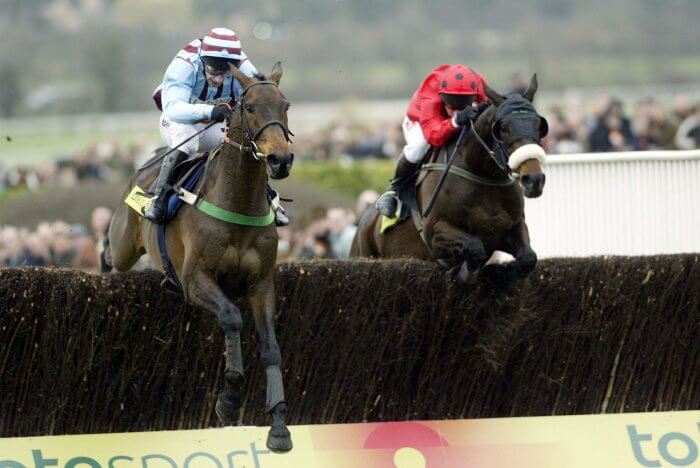 Best Mate and Jim Culloty clear the final fence, heading for their third Gold Cup victory.